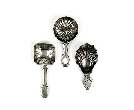 A George V silver caddy spoon with shell bowl and two continental silver caddy spoons. The Georgian style spoon with scallop 