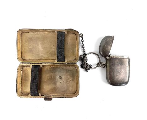 A George V silver cigarette case and a Victorian vesta case. The cigarette case engine turned and with suspension chain, Birm