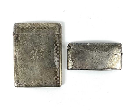 An Edwardian silver calling card case and a Victorian hipped card case. The card case with engine turned decoration, London 1