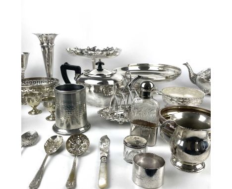 A large collection of silver plated wares. Including a three piece teaset, a spirit flask, a pair of silver plate on copper w