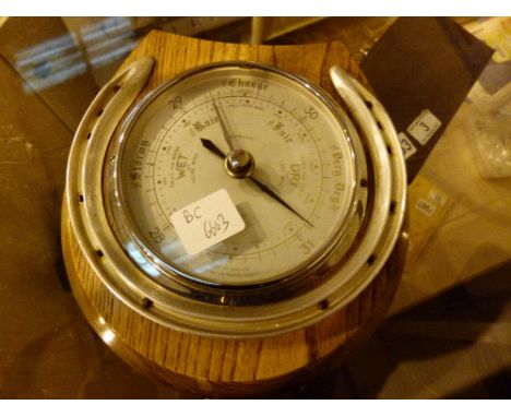 Vintage barometer in horse shoe design