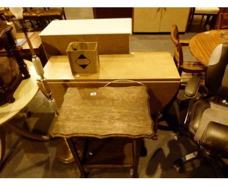 Two tables and a standard lamp
