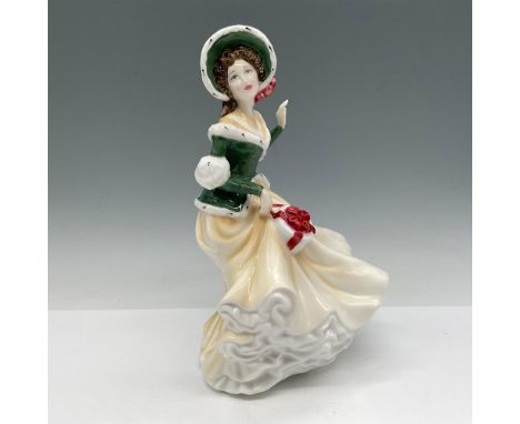 Part of the Christmas Day figures, lovely lady dressed for the holidays, colored in cream, green, white and red. Royal Doulto