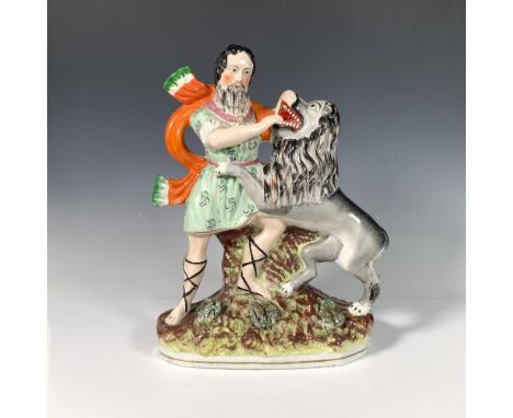 Colorful ceramic figure depicting the biblical scene of Samson showcasing his immense strength as he tears a lion apart with 