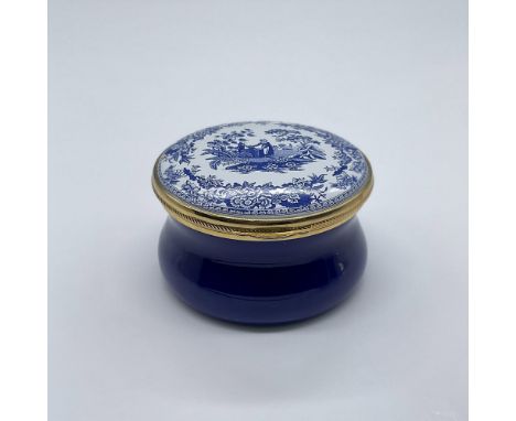 This small blue and white fine enamel box with golden accents showcases an image of a girl fetching water from a well surroun