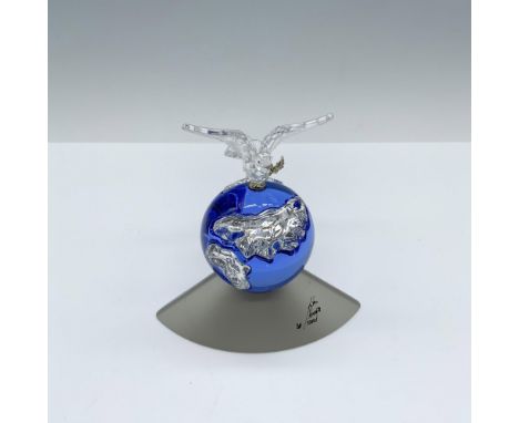 This Millennium Edition 238985 figure was designed to celebrate the new Millennium. It features a blue globe with crystal cut