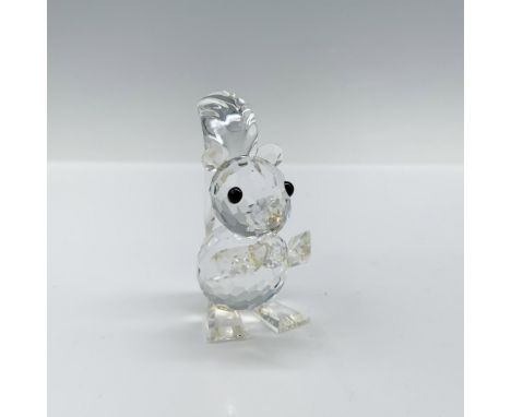 Squirrel feeding on a nut with a clear cut crystal body with black eyes. Swarovski backstamp 7662 NR 42. This item has its or