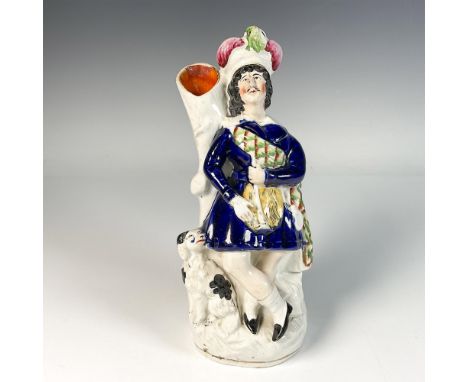 Hand painted and hand decorated porcelain vase featuring a man in classic blue attire leaning against hollow trunk, accompani