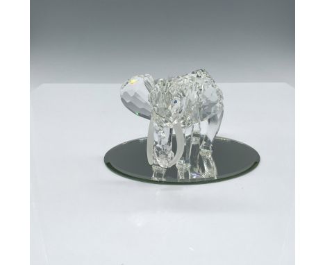 Spectacular clear crystal elephant mid-stride with trunk curled under, and satin tusks. Swarovski backstamp. This item has it