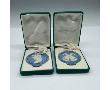 Round blue disc with raised stocking with toys and bells. Wedgwood impressed mark. This item has its original box: 2.75"L x 3