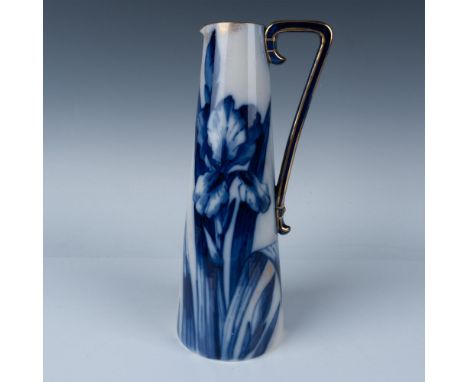 This Doulton porcelain floral pitcher features a beige-toned body adorned with a painterly blue floral design. The handle is 