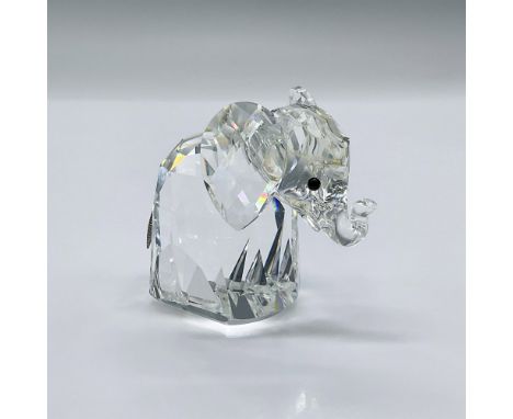 This adorable elephant is made from clear crystal with black eyes and a metal tail. This item has its original box measuring 