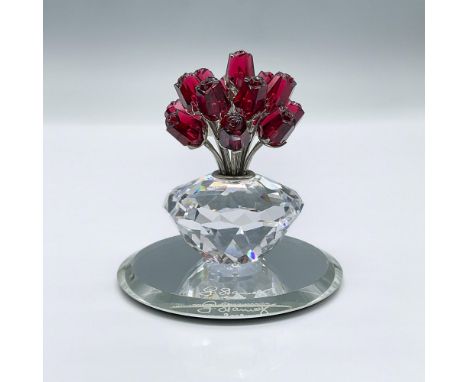 A limited edition vase of 15 red roses with rhodium stems. This figure was made to celebrate the 15th anniversary of the SCS.
