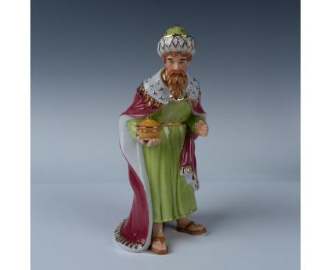 Melchior is part of the Holiday Traditions Nativity series. Handcrafted and accented in 22k gold, this porcelain figurine is 