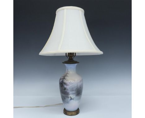 Beautiful porcelain or bone china vase converted into a lamp. Decorated on the exterior in soft colors depicting a landscape 