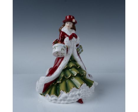 Hand decorated bone china figurine from the Pretty Ladies series. Depicts a woman in a red overcoat and hat walking with pres