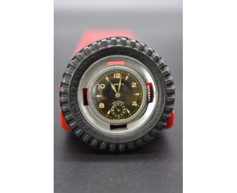 A circa 1950s Marvin 'Dunlop Tyres' steel and rubber novelty watch, manual wind, 5cm. 