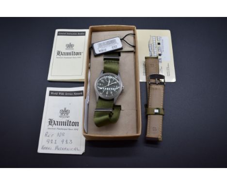 A boxed Hamilton 'Khaki' stainless steel manual wind wristwatch, Ref. 921 923, 35mm, on replacement strap, with instructions.