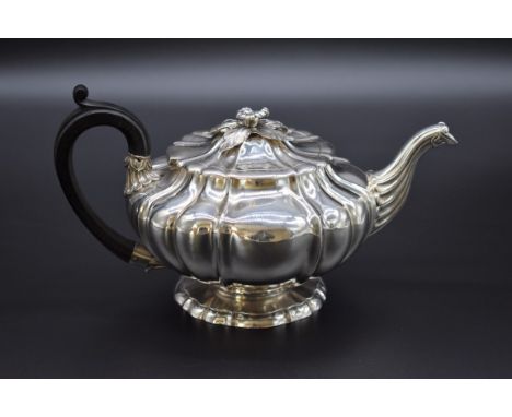 A George IV silver melon shaped teapot, by Paul Storr, London 1827, 925g all in. 