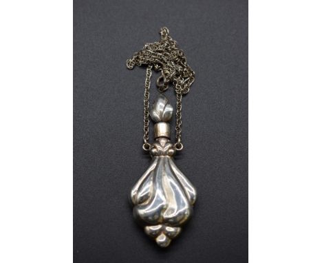 A silver scent flask, on attached necklace chain stamped .925, 6.5cm, 16g 