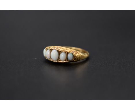 An 18ct gold and opal five stone ring, total weight 2.4g, size K. 