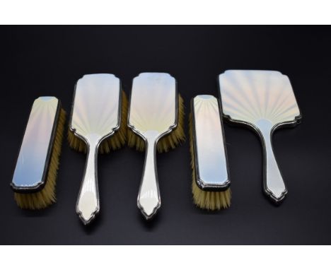 A silver and guilloche enamel five piece dressing set, by&nbsp;William Comyns &amp; Sons Ltd,&nbsp;London 1947-9. 