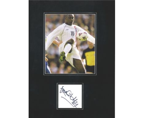Football Emile Heskey 16x12 mounted signature piece includes signed album page and photo playing for England. Good Condition.