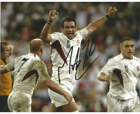 Martin Johnson Signed 2003 England Rugby World Cup 8x10 Photo. Good Condition. All signed pieces come with a Certificate of A