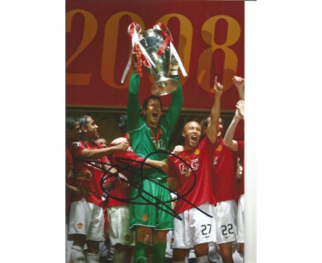 Football Edwin Van Der Sar signed 12x8 colour photo pictured lifting the Champions League Trophy while playing for Manchester