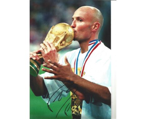 Football Frank Leboeuf signed 12x8 colour photo pictured with the World Cup while playing for France. Franck Alain James Lebo