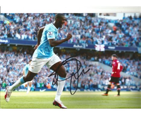 Football Yaya Toure signed 12x8 colour photo pictured celebrating while playing for Manchester City. Good Condition. All sign