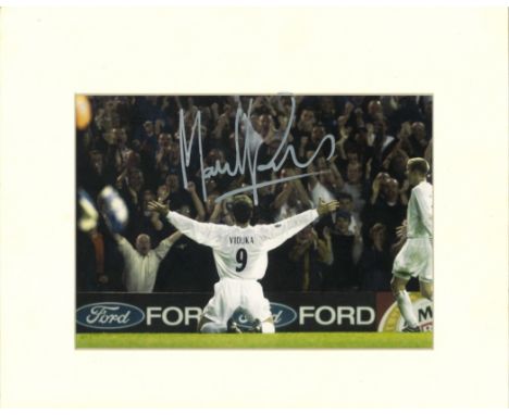 Football Mark Viduka signed 14x12 mounted colour photo pictured celebrating while playing for Leeds United. Good Condition. A