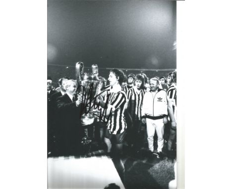 Football Johan Cruyff signed 12x8 black and white photo pictured receiving the European Cup during AJAX glory years. Good Con