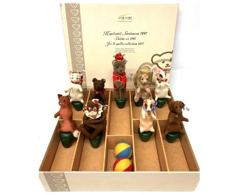 Limited Edition 1897 Reproduction Steiff Skittle Set with nine animal figures on green wooden bases and two felt balls, in or
