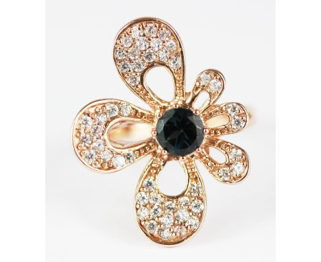 A 925 silver rose gold gilt ring set with a round cut London blue topaz and cubic zirconia, (R.5), 3 x 2.2cm. Condition : exc
