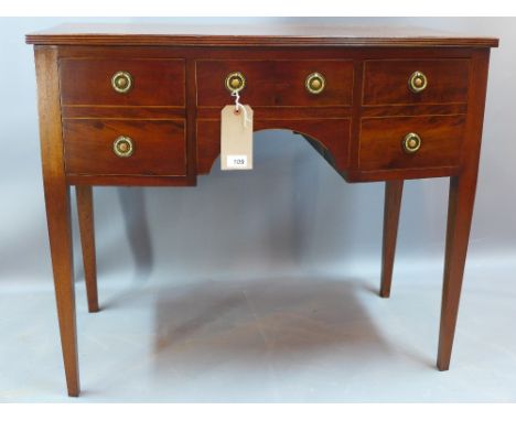 A Georgian mahogany bow fronted kneehole side table fitted with cupboards and drawers H 77 x W 90 x D 50cm