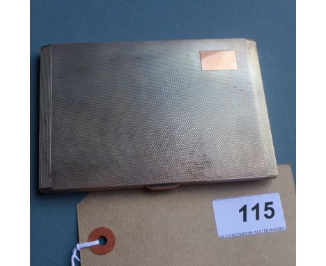An English hallmarked sterling silver cigarette box having engine turned decoration and rose gold detail, W 13 x D 9cm 