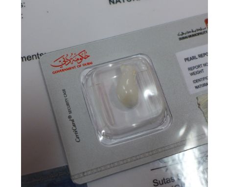 A natural non - nacreous salt water pearl, of baroque shape, 9.16 ct with certificate from the Dubai central laboratory 