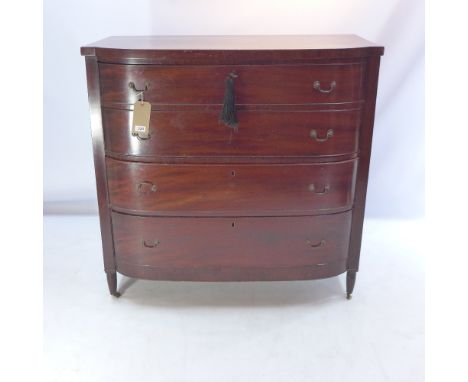 A Regency mahogany bow fronted chest of four graduating drawers raised on gun barrel legs and castors, H 106 x W 108 x D 57cm