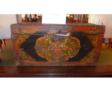 A 19th century Tibetan trunk with painted dragons head, H 39 x W 77 x D 28cm  