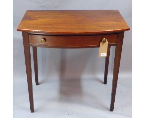 A 20th century mahogany bow fronted side table with single drawer and raised on square tapered legs, H 75 x W 76 x D 47cm 