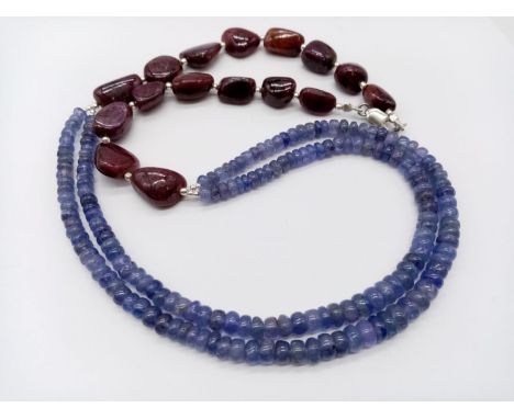 263cts two row cabochon tanzanite necklace with tumbled ruby beads. 52.8 grams in weight.44cm approx in length. 
