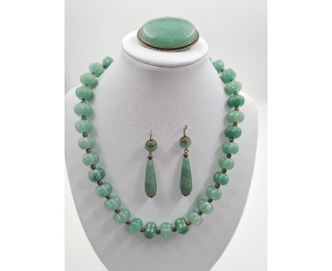 A Beautiful Set of Jade Jewellery. Including a 44cm, 30 piece necklace. A 4cm Brooch and a pair of 3cm drop Earrings.