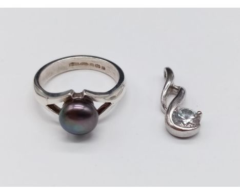 A miniature Silver Pendant(2cm) and Ring, Size N. 5.22g total weight. 
