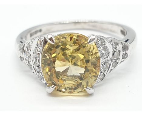 3.5ct Natural Sri Lankan yellow sapphire shape oval stone in a vintage platinum setting. Weighs 5.3g and size L. 