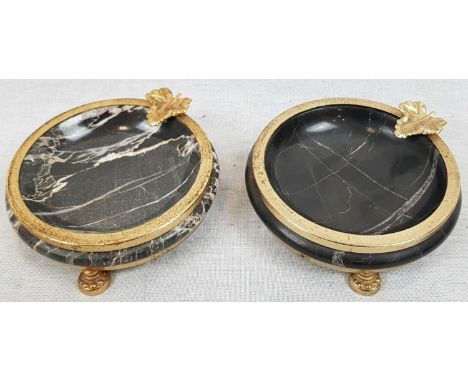 A Pair of Vintage Marble Ashtrays. Black marble with gilded decoration, including leaf cigarette holder. Small pedestal feet.