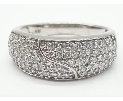 18ct diamond encrusted stylist ring. Weighs 5.6g and is a size O. 