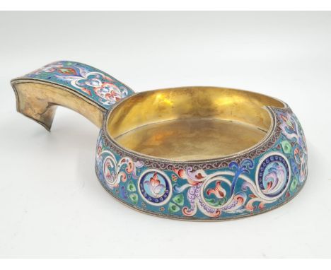 An Antique Russian Silver Gilt and Enamel Kovsh. Enamelled with floral garlands against cream and green grounds. Hook Handles