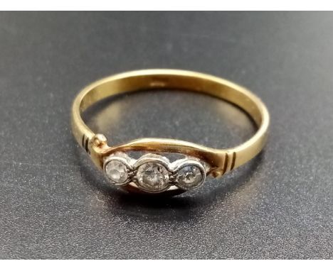 An 18ct Gold and Diamond Ladies Ring. A trilogy of diamonds (.2ct). 2.2g total weight. Size U 