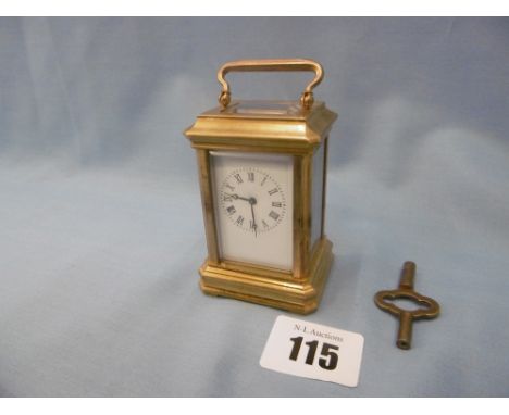 A miniature gilt brass carriage clock 